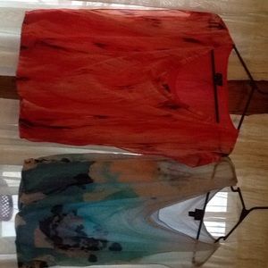 2 light sleeveless dress shirts never worn.